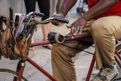 Low section of man riding bicycle