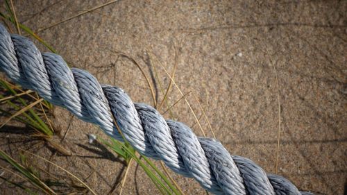 High angle view of rope against land