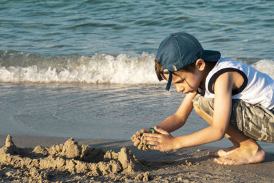 Side view of boy on beach