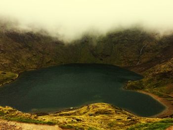 High angle view of fog over land