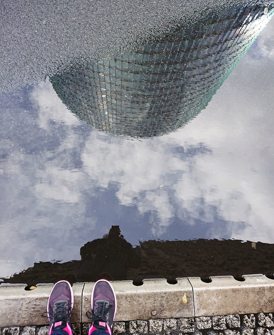 LOW SECTION OF MAN STANDING AGAINST SKY