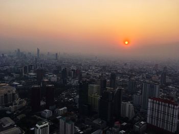 High angle view of buildings against sky during sunset