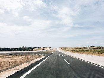 Empty road against sky