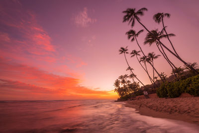 Scenic view of sea against orange sky