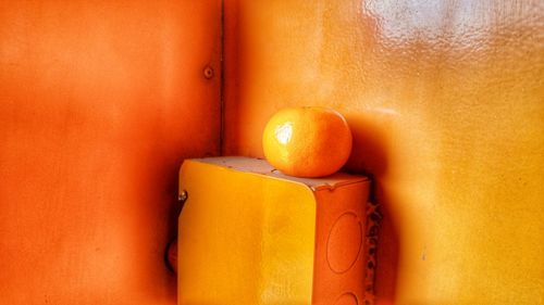 Close-up of orange fruit on yellow box