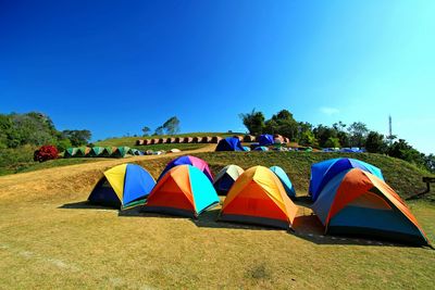 Multi colored tent against clear blue sky