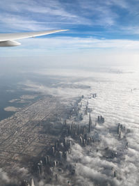 Aerial view on the burj khalifa and downtown dubai covered in fog