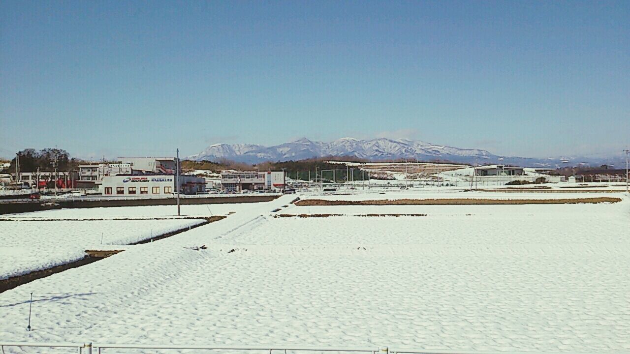 snow, clear sky, winter, cold temperature, copy space, built structure, architecture, building exterior, blue, season, house, mountain, white color, covering, weather, day, residential structure, frozen, nature, outdoors