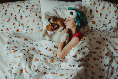 High angle view of dog lying on bed