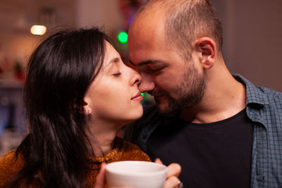 Portrait of young woman with drink