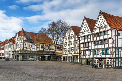 View of buildings against cloudy sky