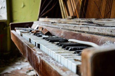 Close-up of old broken piano at home