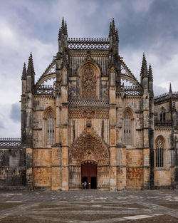 Facade of historic building against sky