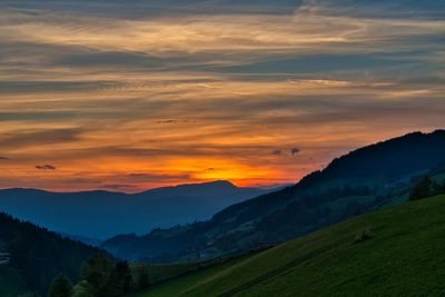 Scenic view of mountains against sky during sunset