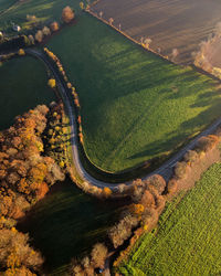 Aerial shot of a curvy fall road in france