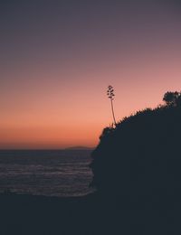 Scenic view of sea against clear sky during sunset