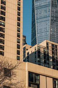 Low angle view of modern buildings against clear sky