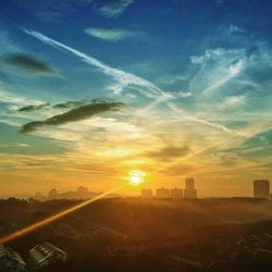 Scenic view of landscape against sky at sunset