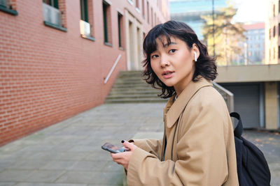 Young woman using mobile phone