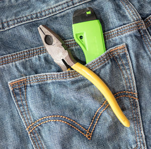 Close-up of work tools in back pocket