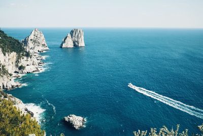 Scenic view of rock formations in sea at capri