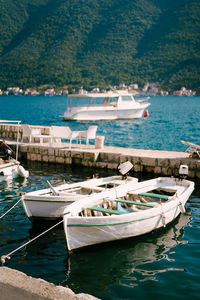 Boats moored at harbor