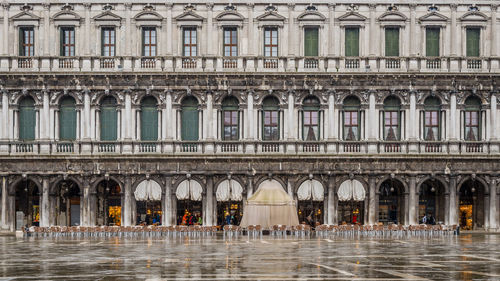 A wet, early morning after the high tide in venice and piazza san marco is all but empty.