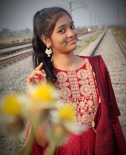 Portrait of smiling girl standing outdoors