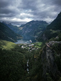 Scenic view of lake and mountains against sky