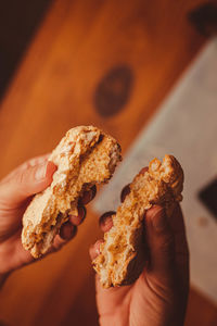 Cropped hand of person holding food