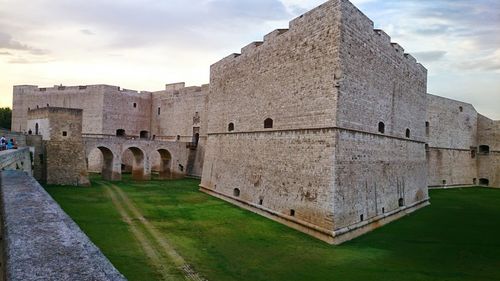 Fort on field against sky