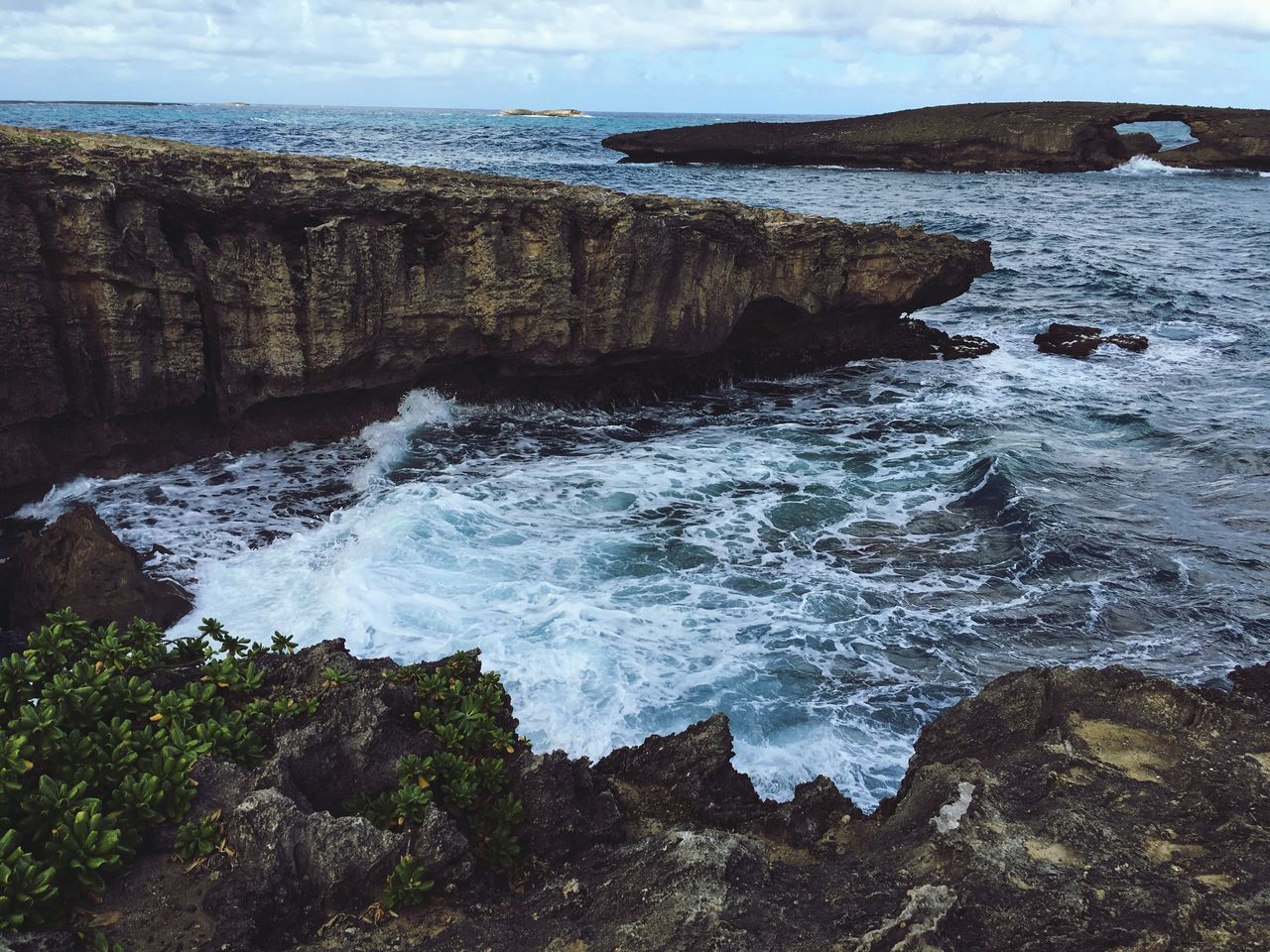 water, sea, scenics, beauty in nature, tranquil scene, surf, wave, rock - object, tranquility, nature, rock formation, horizon over water, sky, shore, beach, coastline, idyllic, rock, motion, high angle view