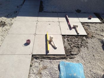 High angle view of arrow symbol on footpath