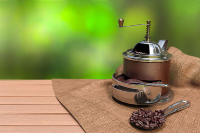 Close-up of coffee grinder on table