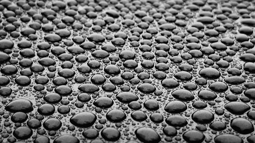 Full frame shot of water drops on pebbles