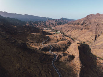 Road through mountain range at los azulejos de veneguera, grand canary, canary islands, spain