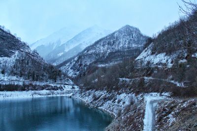 Scenic view of snowcapped mountains against sky