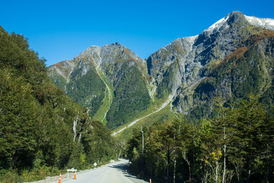 Scenic view of mountains against clear blue sky