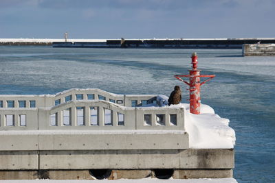 Built structure on beach against sky