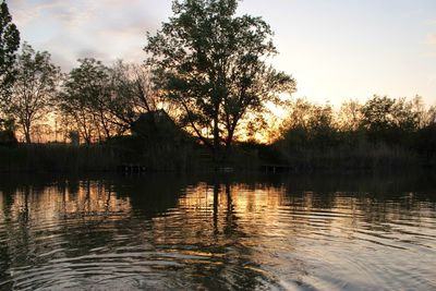 Scenic view of lake at sunset