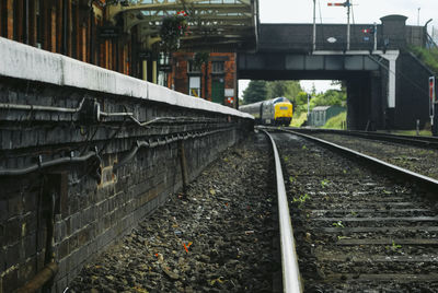 Railroad tracks amidst buildings