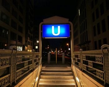 Illuminated staircase of building at night