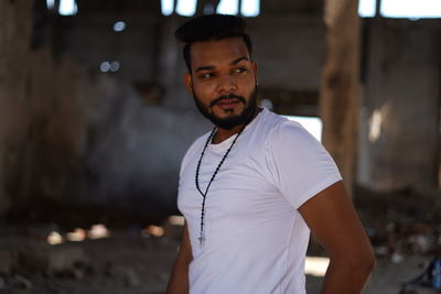 Portrait of young man standing outdoors