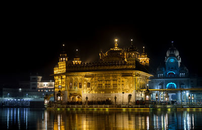 Reflection of illuminated buildings in water at night