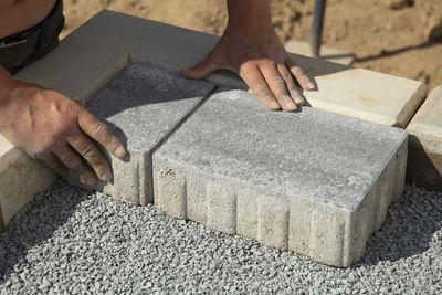 Cropped hands of man working on wood