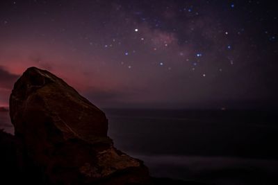 Scenic view of rocks at night