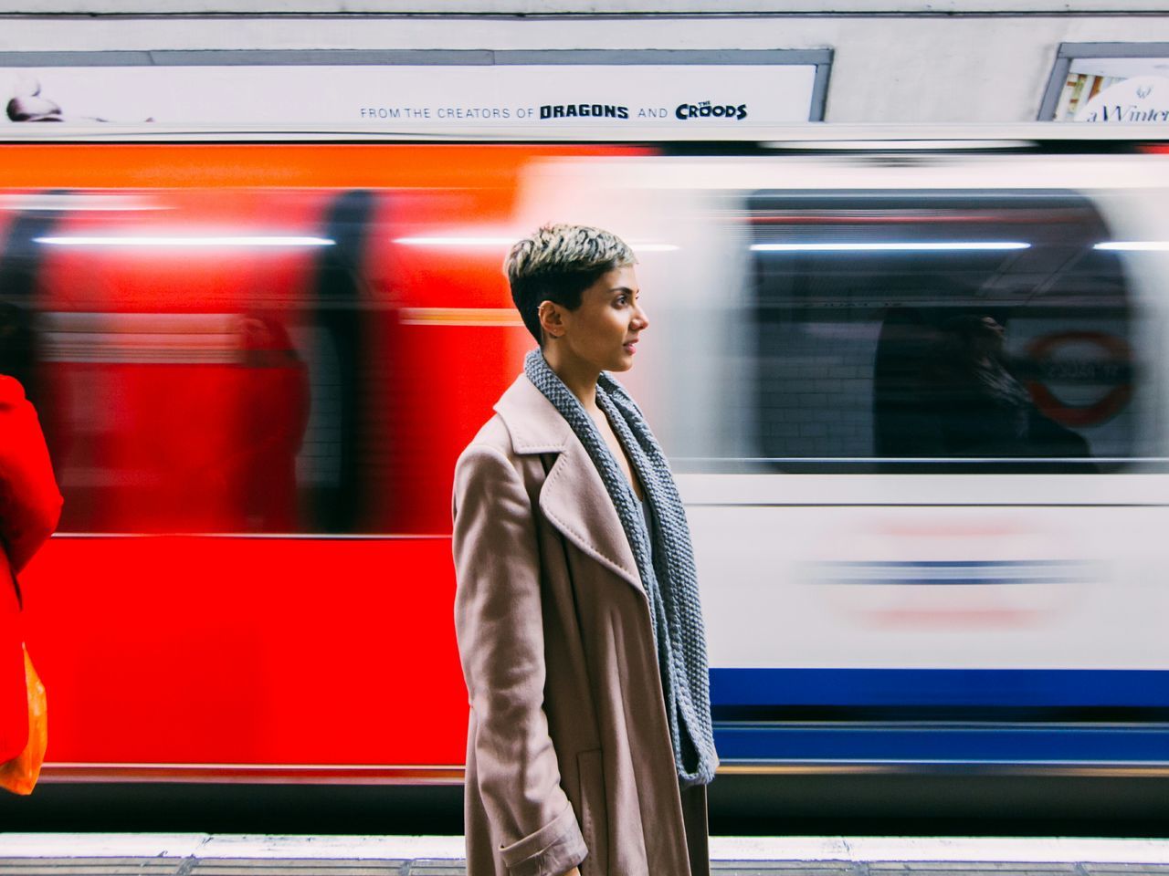 lifestyles, indoors, transportation, public transportation, leisure activity, casual clothing, standing, three quarter length, travel, mode of transport, railroad station, train - vehicle, men, young adult, waist up, window, rail transportation, rear view