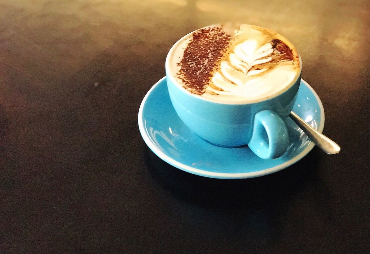 CLOSE-UP OF CAPPUCCINO ON TABLE