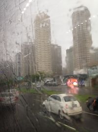 Traffic on road in city during rainy season