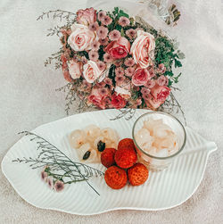 High angle view of roses in plate on table
